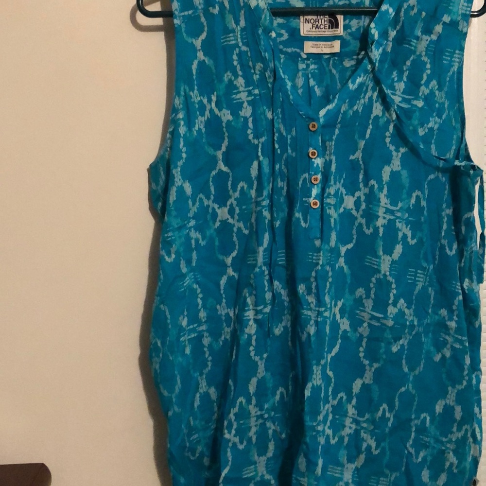 Greenish Blue Blouse brand is THE NORTH FACE .